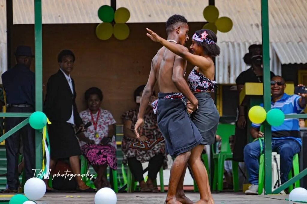 Students wearing disturbing makeup and performing inappropriate acts, while teachers and head teachers laugh and enjoy from the sidelines—this is not cultural celebration, this is a promotion of pamuk pasin (immoral behavior) and teenage confusion. png bulletin